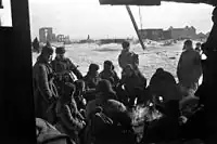 Soviet troops during a lull in the fighting. The mill can be seen on the distance on the right.