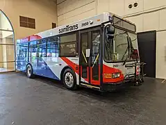 Low Floor (2014) for SamTrans, note larger door glass (square corners) and frameless side windows