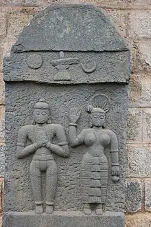 A Sati stone (satigal) with old Kannada inscription of 1206 in Kedareshvara temple at Balligavi
