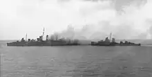 Image 81American destroyers evacuating the crew of HMAS Canberra after the Battle of Savo Island (from History of the Royal Australian Navy)