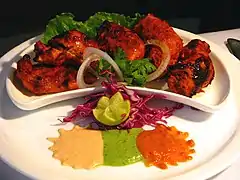 Image 43Chicken tikka, a well-known dish across the globe, reflects the South Asian cooking style.  (from Culture of Asia)