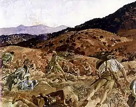 A reproduction image of a painting in which a battle scene is depicted. The terrain is rocky and undulating and men in shorts and shirts carrying rifles are falling to the ground as they are shot down from defenders standing in another trench.