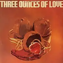 Three cherries cordial, one of which is open and has an amul