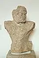 Torso of a statue of Heracles, from older temple of Apollo, c. 570–560 BC.