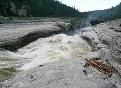 Rapids on Trout River, from Mackenzie Highway61°8′42″N 119°50′46″W﻿ / ﻿61.14500°N 119.84611°W﻿ / 61.14500; -119.84611