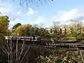 Metropolitan line train riding to the north of the park
