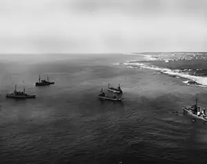 USS Baldwin, at right, during operations to refloat her at Montauk Point on 28 April 1961. Among the ships engaged in the salvage effort are USS Hoist (ARS-40), USS Salvager (ARS(D)-3), USS Windlass (ARS(D)-4) and a fleet tug (ATF).