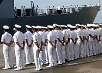Royal Brunei Navy personally salute stance as USS Jarrett (FFG-33) pulls into Muara Port, Brunei during CARAT 2007.