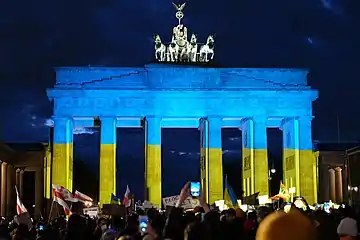 The Brandenburg Gate lit up in the colors of the Ukrainian flag during a solidarity protest in Berlin, Germany, on 24 February 2022