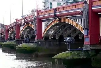 Image 26Vauxhall Bridge across the River Thames opened in 1906 and features sculptures by F. W. Pomeroy.
