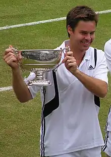 Image 52Todd Woodbridge holding the Gentlemen's doubles silver challenge cup in 2004 (from Wimbledon Championships)