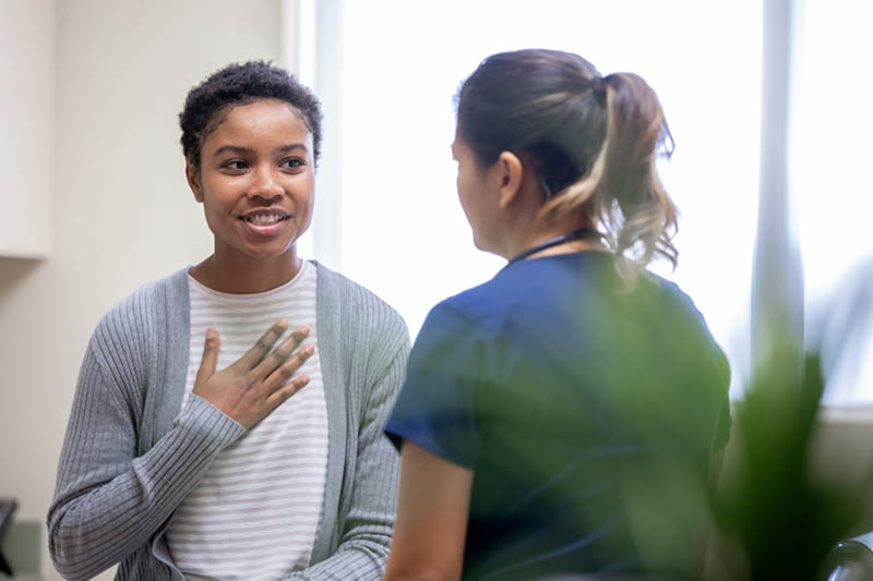 woman talking to doctor